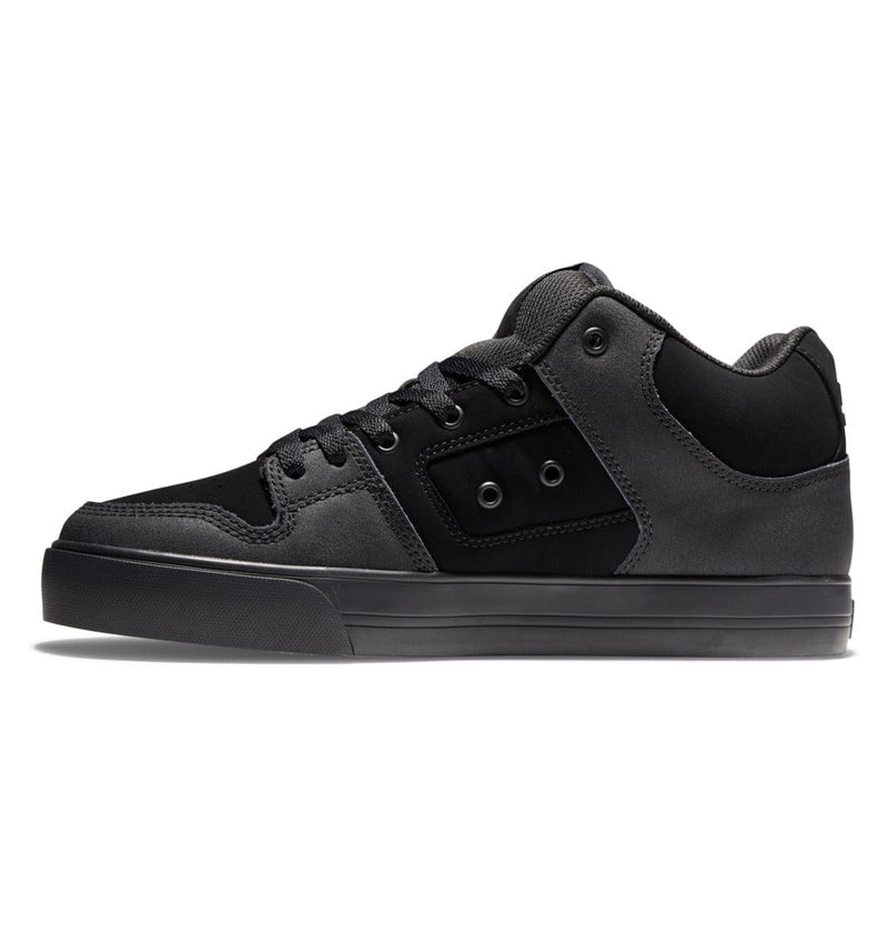 DC Footwear Pure Mid sneakers in black and charcoal gray with suede and leather upper, side view showcasing padded collar and durable outsole.