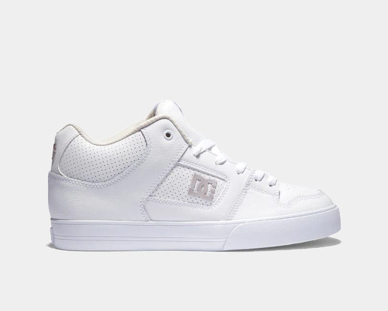 DC Footwear Pure Mid sneakers in white with perforated leather upper, contrast stitching, and mid-top design, side view.