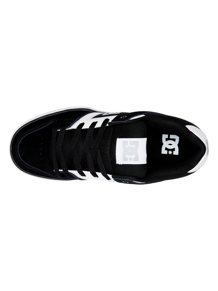 DC Footwear Pure skate shoes top view showcasing black and white color scheme, padded tongue, and lace-up closure.