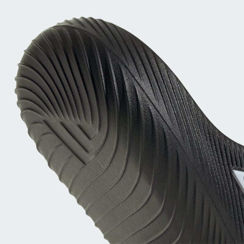 Adidas PURECHILL Slides in black with textured rubber sole, detailed side view.