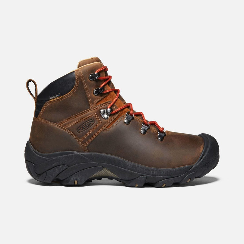 Keen Pyrenees hiking boots in brown leather with black rubber outsole, red laces, and waterproof construction, side view.