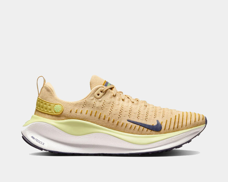 Nike React Infinity Run Flyknit 4 running shoes in beige with yellow accents, Flyknit upper, and React foam midsole, side view.