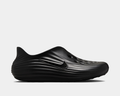 Nike ReactX Rejuven8 slip-on shoes in black with a textured rippled design, perforations for breathability, and side view showcasing the streamlined silhouette and iconic Nike Swoosh.