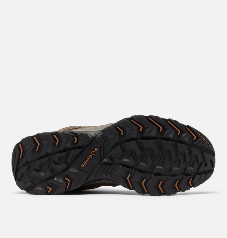 Columbia Redmond™ III Mid Waterproof hiking boots outsole showing rugged black rubber tread with orange accents for traction and durability.