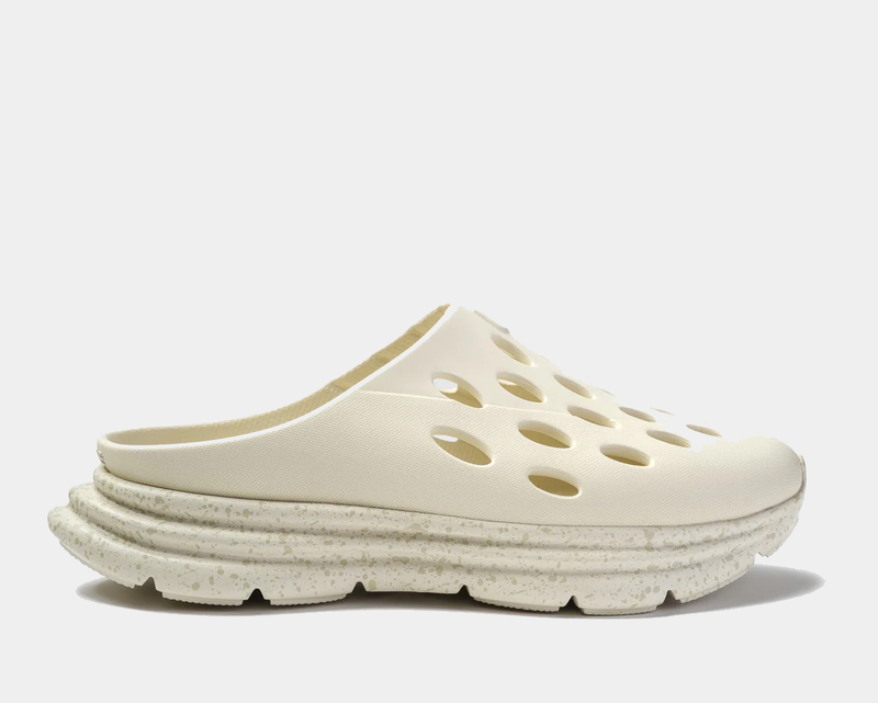 Kane Revive OB slip-on recovery shoes in off-white with perforated upper and speckled foam sole, side view.