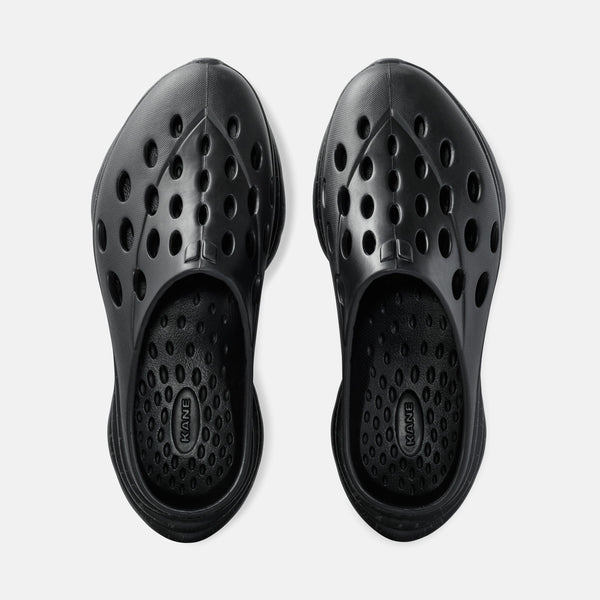 Kane Revive OB slip-on recovery shoes in black with perforated design and cushioned footbed, top view.