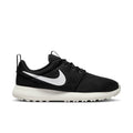 Nike Roshe Golf Next Nature golf shoes in black with a breathable mesh upper, white midsole, and Swoosh logo, side view.