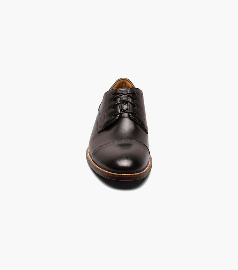 Florsheim Rucci Cap Oxford dress shoe in polished black leather with cap toe detailing and brown outsole, front view.