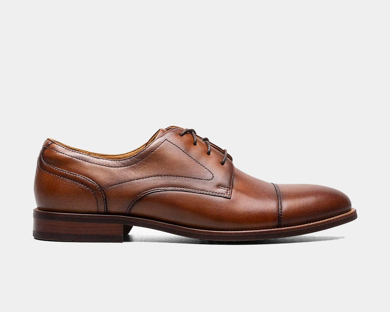 Florsheim Rucci Cap Oxford dress shoes in rich tan leather with cap toe detailing and lace-up closure, side view.