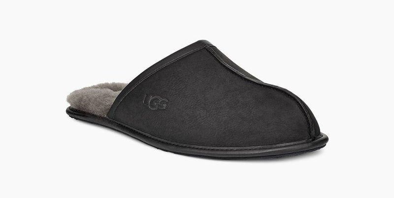 UGG Scuff Leather Slipper in black with suede upper, plush shearling lining, and embossed logo, side view.