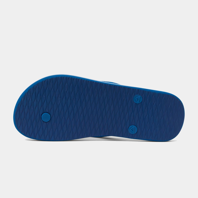 Reef Seaside Prints flip-flops with blue textured rubber sole, bottom view.