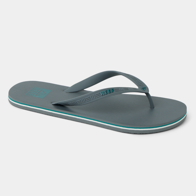 Reef Seaside flip-flops in gray with embossed strap details and aqua accents, angled side view.
