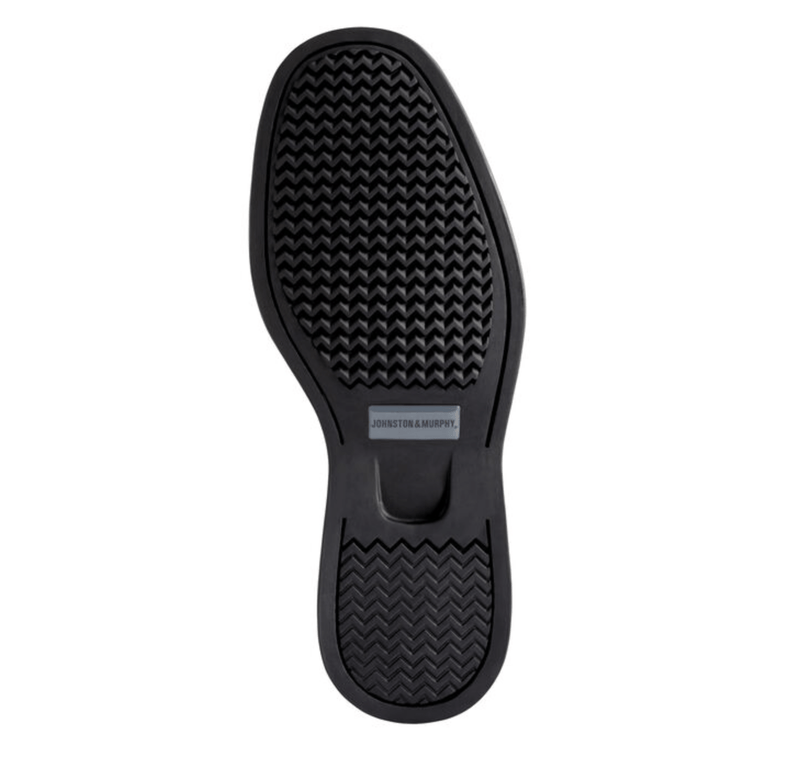 Johnston & Murphy Shuler Bicycle sole view showing black rubber outsole with textured grip pattern and branding.