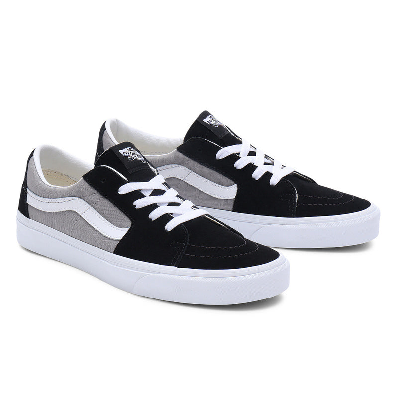 Vans Sk8-Low skate shoes in black and gray with suede and canvas upper, white laces, and signature side stripe, front angle view.