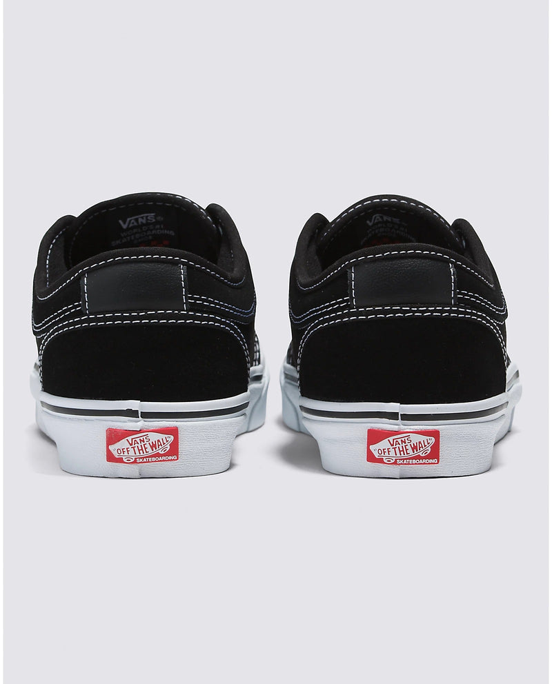 Vans Skate Chukka Low skate shoes in black suede with white stitching and red "Off the Wall" heel logo, back view.