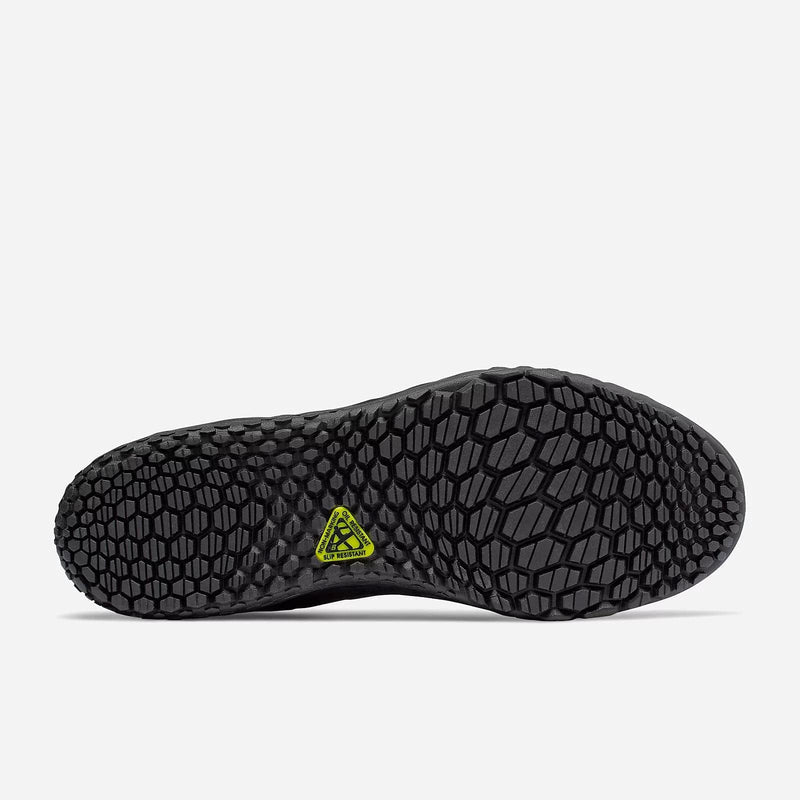 New Balance Slip Resistant Fresh Foam 806 outsole with hexagonal traction pattern and slip-resistant logo in black rubber, bottom view.