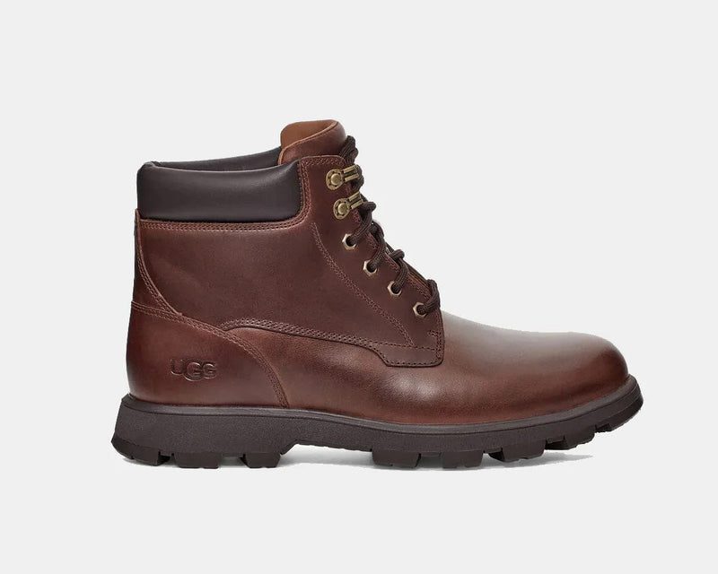 UGG Stenton boots in dark brown leather with padded collar, lace-up design, and durable lug outsole, side view.