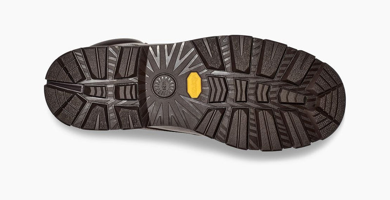 UGG Stenton boots outsole view showcasing durable black Vibram rubber tread pattern with enhanced traction features.