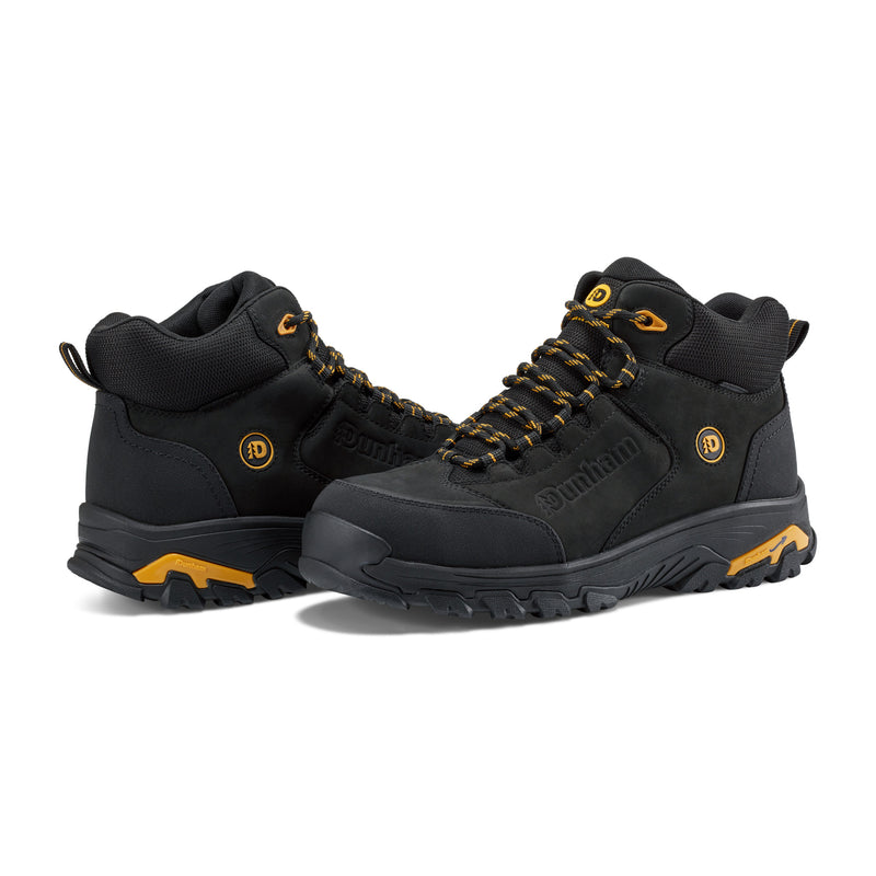 Dunham Stone Safety Toe Work Boot in black with yellow accents, durable leather upper, slip-resistant outsole, and lace-up closure, front side angle.