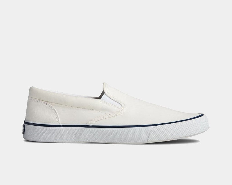 Sperry Striper II Slip On Sneakers in white canvas with tonal stitching and textured rubber sole, side view.