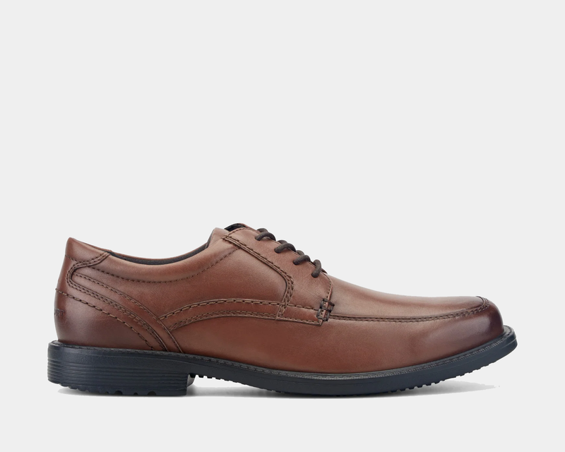 Rockport Style Leader 2 Apron Toe dress shoes in brown leather with apron toe stitching and black rubber sole, side view.