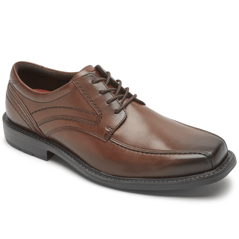 Rockport Style Leader 2 Bike Toe Oxford dress shoes in brown leather with stitched detailing and rounded toe, side angle view.