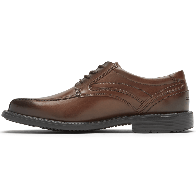 Rockport Style Leader 2 Bike Toe Oxford dress shoes in rich brown leather with stitch detailing and black rubber sole, side view.