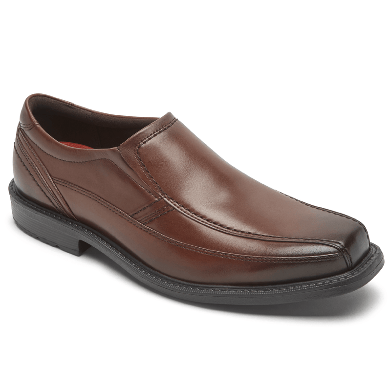 Rockport Style Leader 2 Bike Toe Slip-On dress shoe in brown leather with stitching details and slip-on design, angled side view.