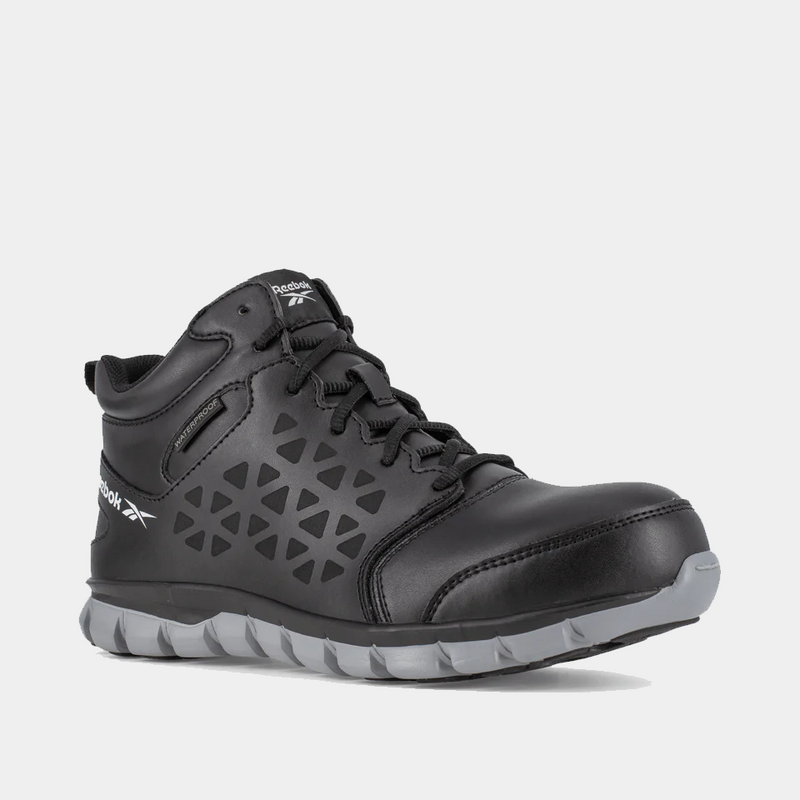 Reebok Work Sublite Cushion Waterproof Composite Toe Boots in black with geometric side panel design, gray outsole, front angle view.
