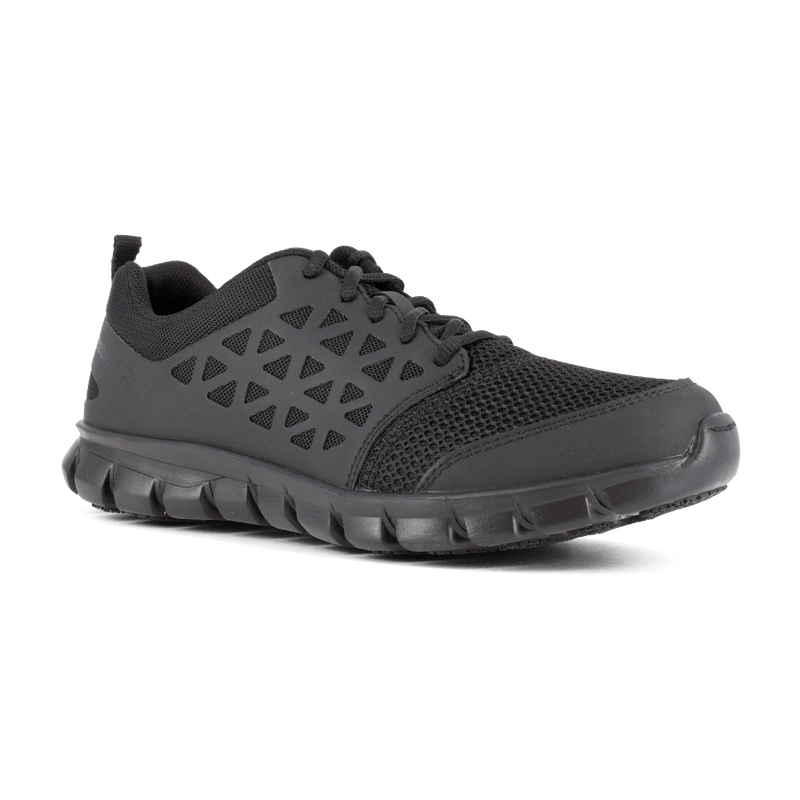 Reebok Work Sublite Cushion Work Soft Toe work shoes in black with mesh upper, geometric side details, and cushioned outsole, angled front view.