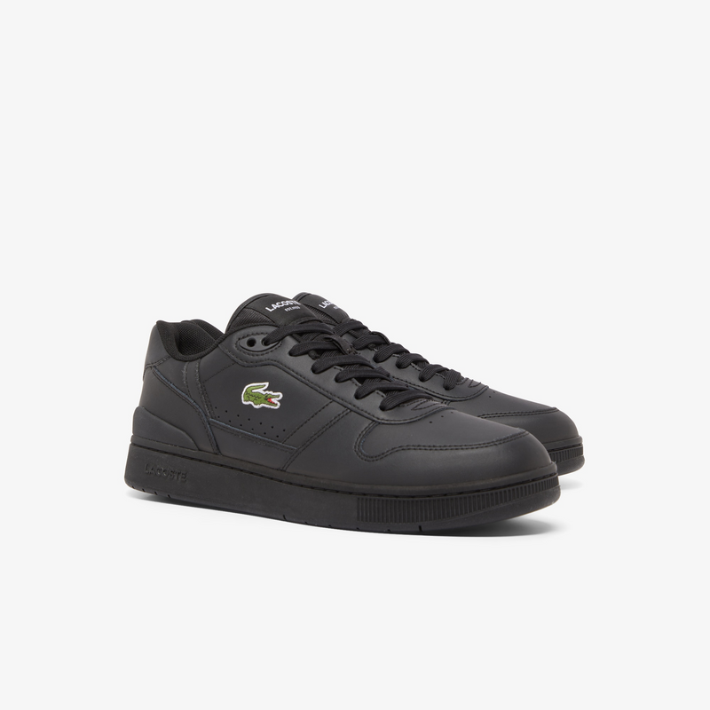 Lacoste T-Clip Set 224 2 SMA sneakers in black leather with embroidered logo, perforated detailing, and black rubber outsole, front angled view.