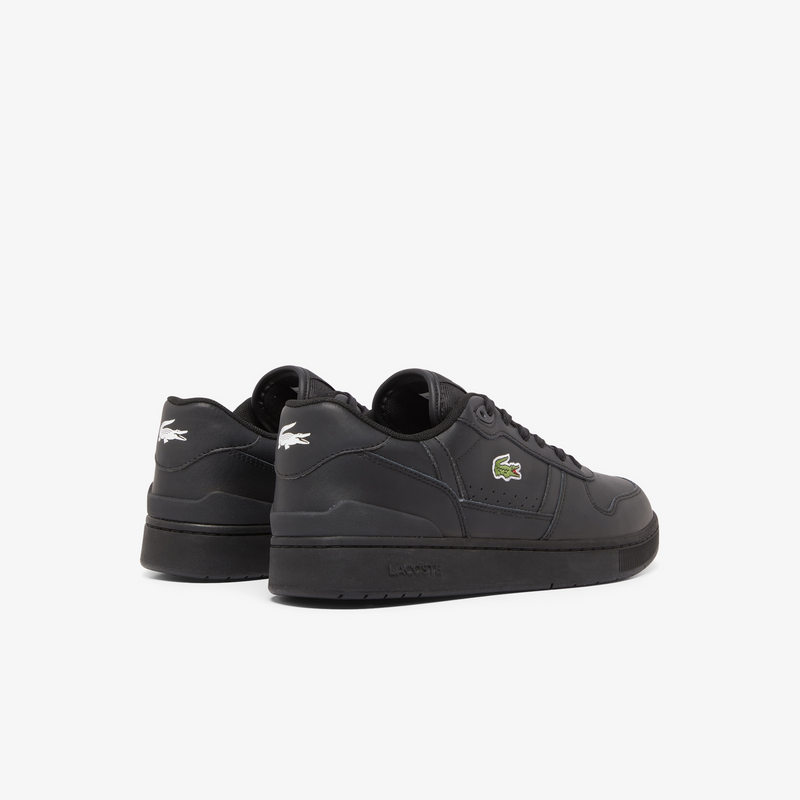 Lacoste T-Clip Set 224 2 SMA sneakers in black with perforated details, green crocodile logo, and embroidered heel branding, back angle.