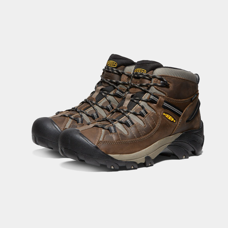 Keen Targhee II Mid hiking boots in brown leather with black rubber toe caps and rugged outsole, angled front-side view.