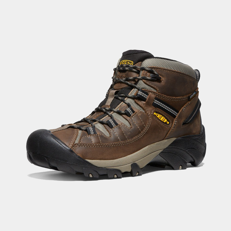 Keen Targhee II Mid hiking boots in brown leather with black rubber toe cap, gray accents, and durable lace system, side angle view.