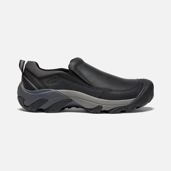 Keen Targhee II Soho slip-on shoes in black leather with gray outsole and rugged tread, side view.