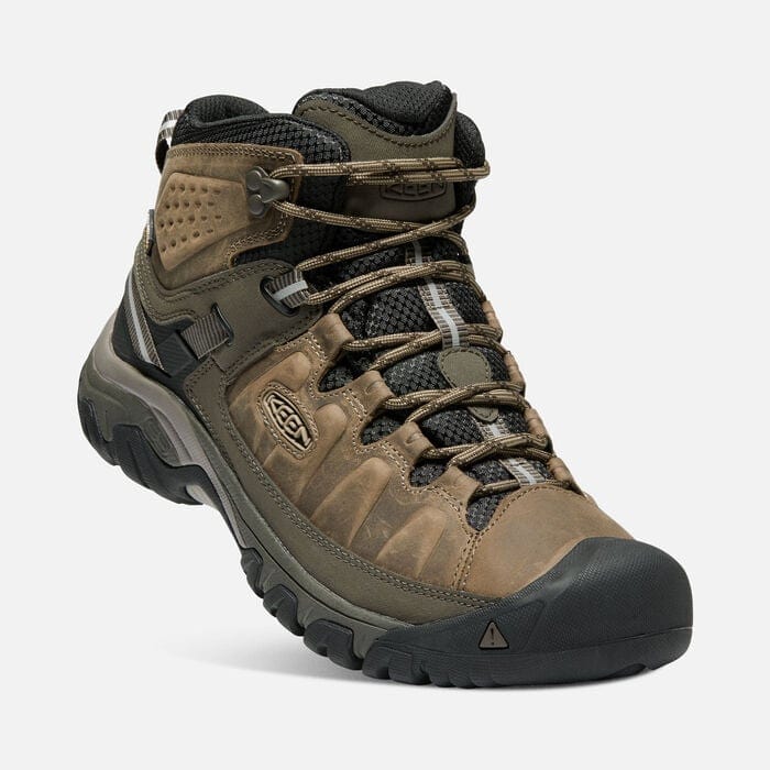 Keen Targhee III Waterproof Mid hiking boots in brown leather with a rugged rubber outsole and secure lacing system, angled view.
