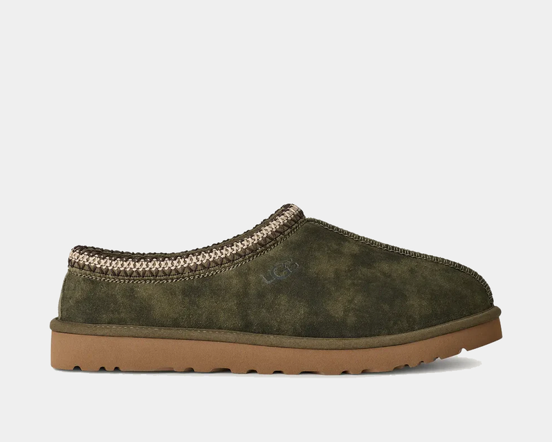 UGG Tasman Baxter slippers in olive green suede with a braided knit collar and a brown rubber outsole, side view.