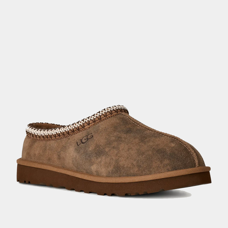 UGG Tasman Baxter slip-on shoes in chestnut brown suede with embroidered details and lightweight outsole, side view.
