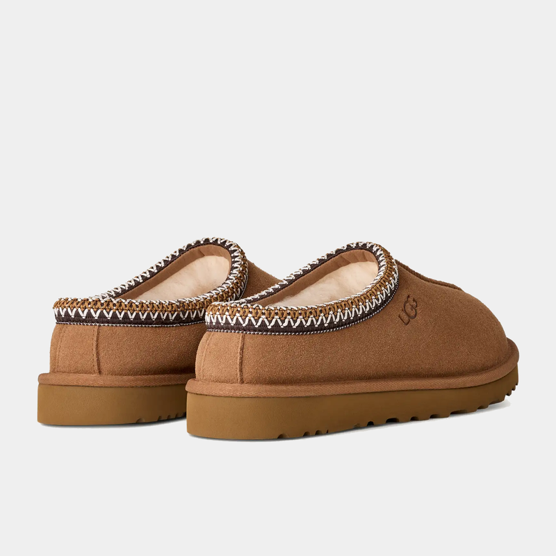 UGG Tasman II Slipper in chestnut brown suede with embroidered trim and plush shearling lining, back angled view showing durable outsole.