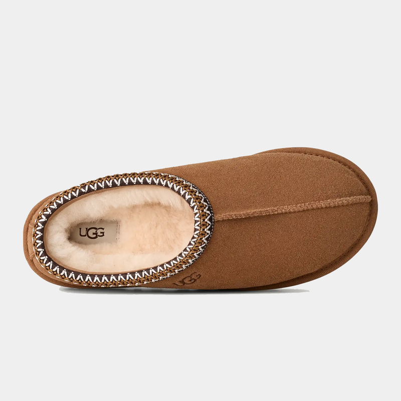 UGG Tasman II Slipper in chestnut brown with suede upper, sheepskin lining, and embroidered braid details, top view.