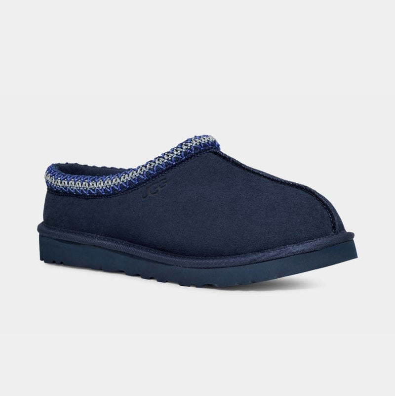 UGG Tasman Slipper in navy blue with suede upper, patterned trim, and durable Treadlite sole, side view.