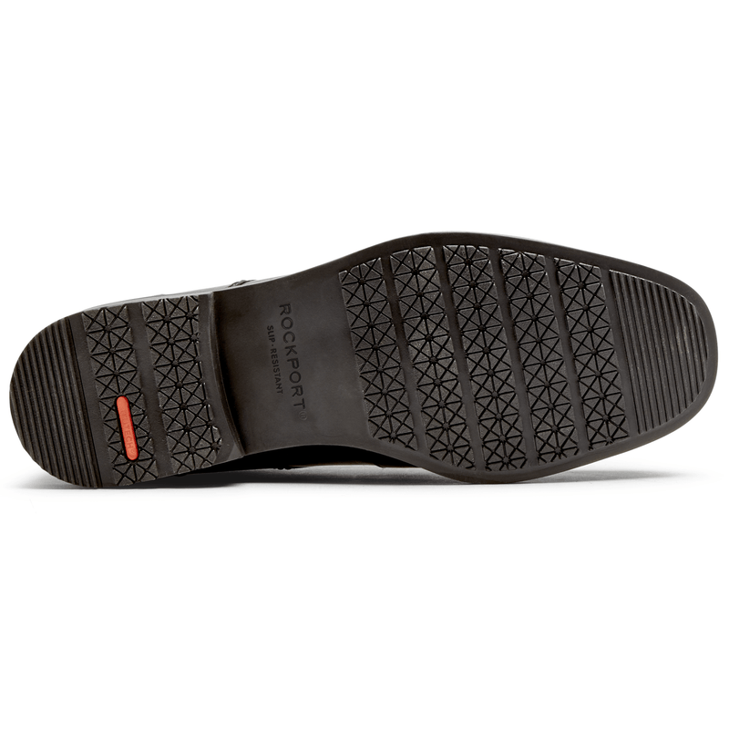 Rockport Taylor Cap Toe shoe outsole in black showing slip-resistant tread pattern and branded detailing.