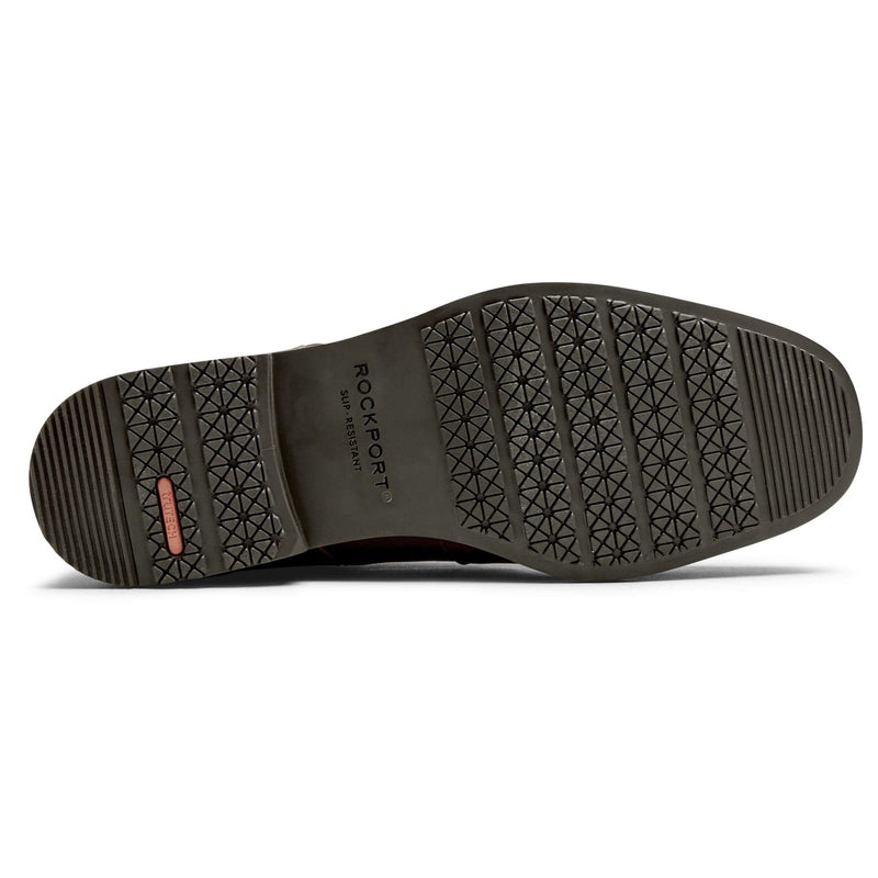 Rockport Taylor Cap Toe shoe sole with slip-resistant tread pattern in black rubber, bottom view.