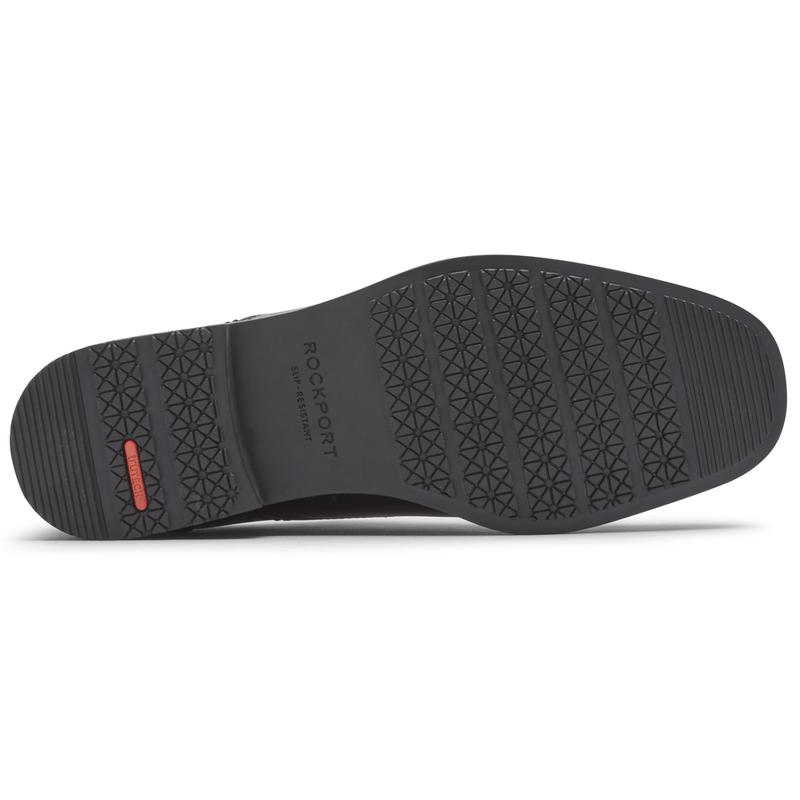 Rockport Taylor Slip On shoe outsole with slip-resistant black rubber and textured tread pattern, sole/bottom view.