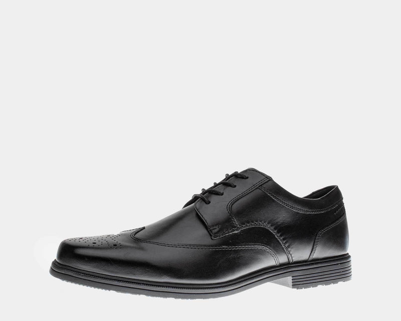 Rockport Taylor Waterproof Wingtip dress shoe in black leather with perforated detailing and durable outsole, side view.