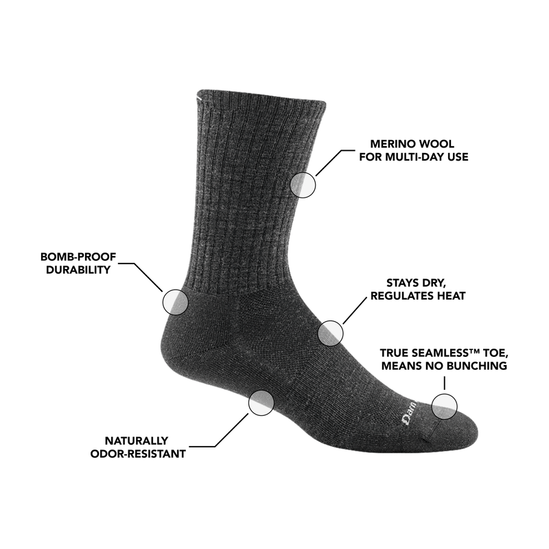 Darn Tough The Standard Crew Light Cushion socks in dark gray with ribbed cuff and light cushioning, side view.