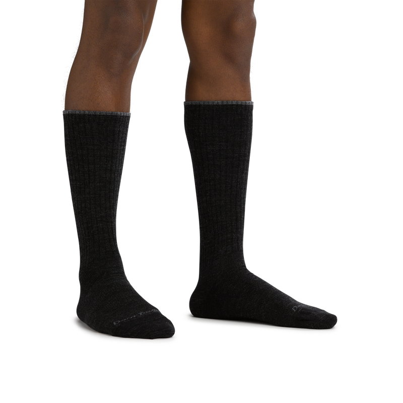 Darn Tough The Standard Mid-Calf Lightweight Lifestyle Socks in black with ribbed texture, worn view.