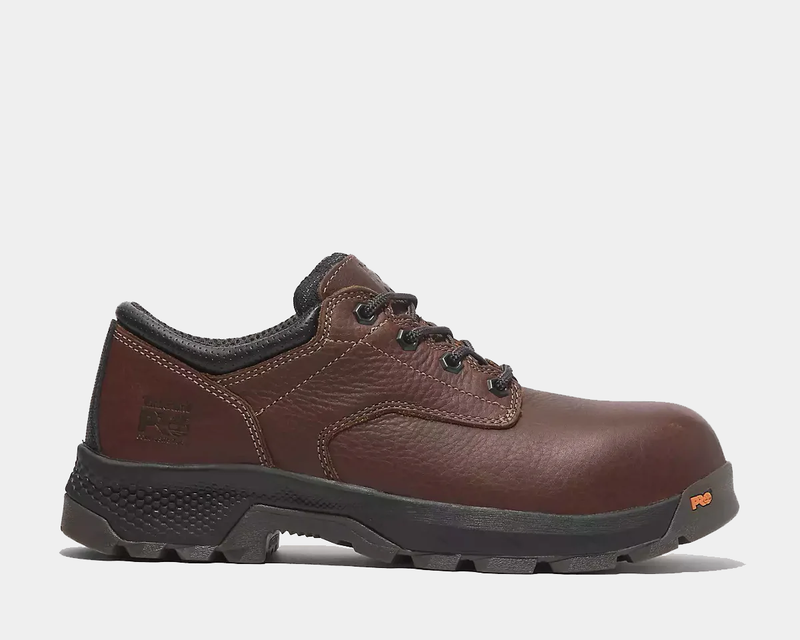 Timberland Pro TiTAN EV Composite Toe Oxford work shoes in brown full-grain leather with rugged outsole and composite safety toe, side view.
