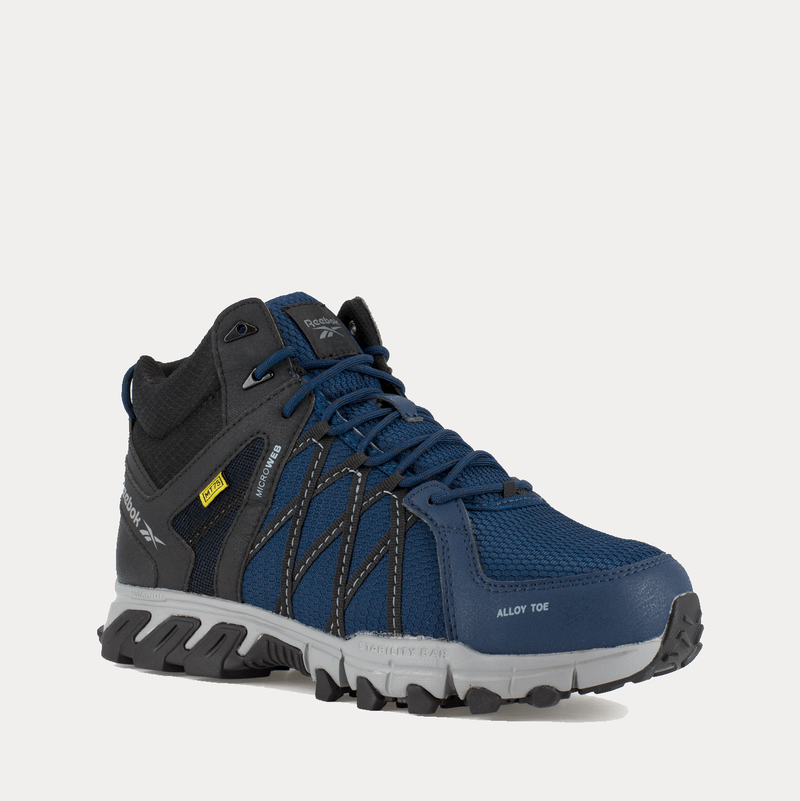 Reebok Work Trailgrip Work alloy toe work shoes in navy blue and black with rugged outsole and breathable mesh upper, front angle view.