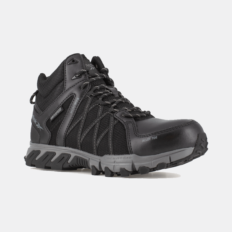 Reebok Work Trailgrip Work boots in black with alloy toe, waterproof design, and rugged outsole, side angle view.